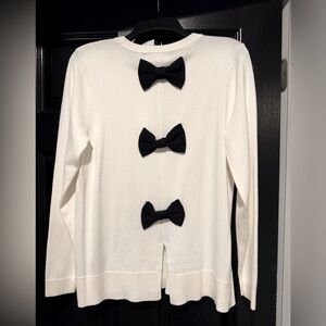 White sweater with bows